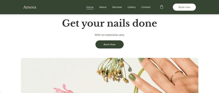 Minimalist website homepage for Amora nail salon featuring green manicured nails and professional services.