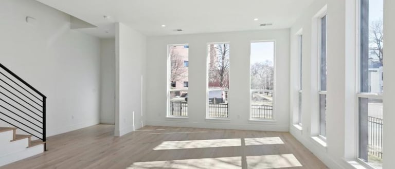 Professional post-construction cleaning service removing dust and debris from a newly renovated home