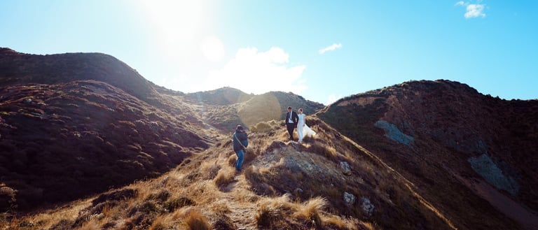 Kent Chua photographing a couple in a stunning outdoor Wellington landscape during a romantic sessio