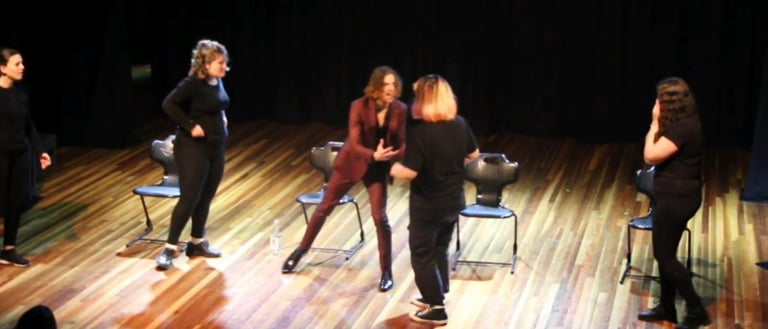 a group of people standing on a stage