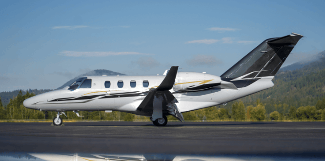 Cessna Citation M2 sitting on an airport ramp.