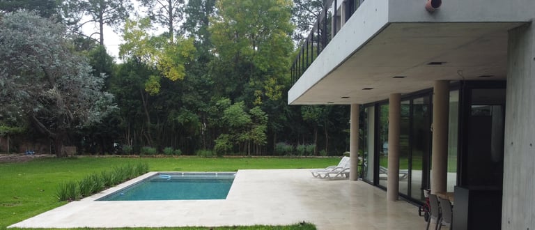 a pool with a chair and a table