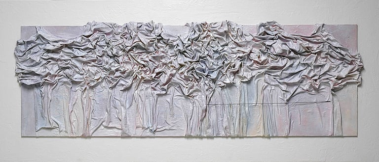 Textured mixed media wall art featuring draped, sculpted fabric in neutral tones on a long canvas.