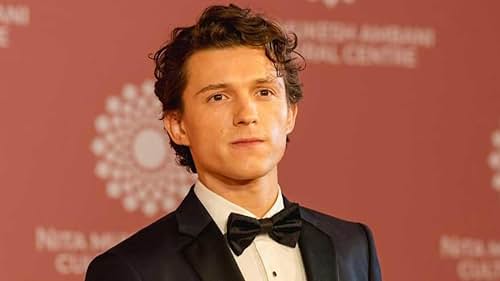 Tom Holland in a tuxedo on the red carpet, sparking speculation about his possible future as James B