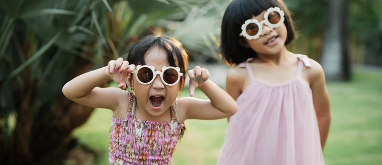 Children playing together at Padma Resort Legian Bali during joyful candid family photography session.