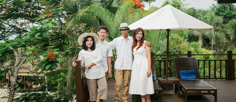 Selly family relaxing in the tropical villa garden at Karma Kandara Bali  