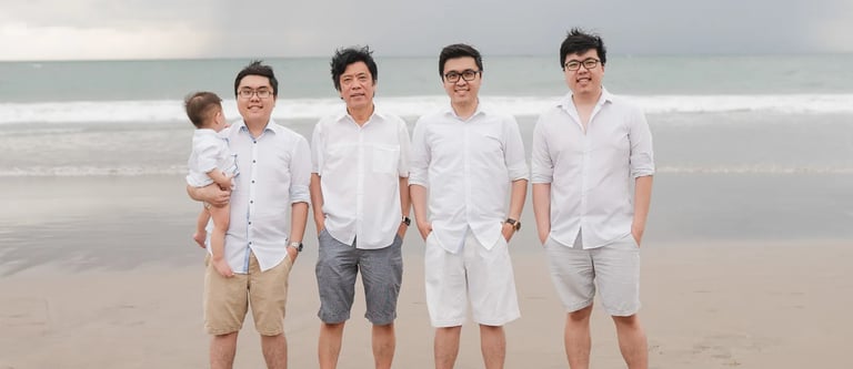 Multigeneration family portrait at Seminyak Beach Bali during relaxed natural family photography session.