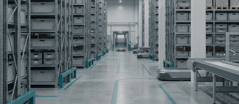 Automated warehouse with industrial shelving units and robotic transport vehicles for smart logistics.