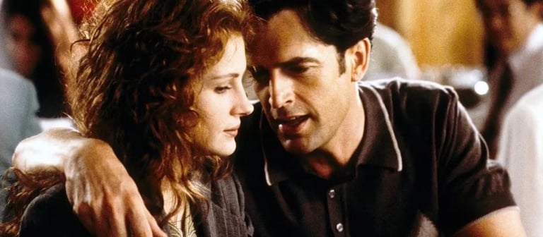 Julia Roberts and Dermot Mulroney in a close moment from My Best Friend’s Wedding (1997), portraying