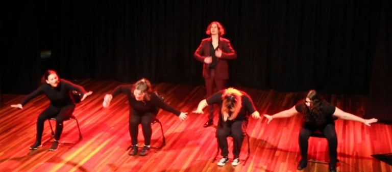 a group of people standing on a stage
