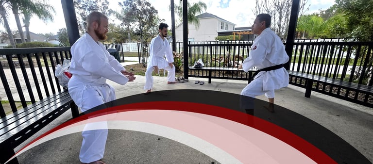 Children and adults training karate in disciplined martial arts environment