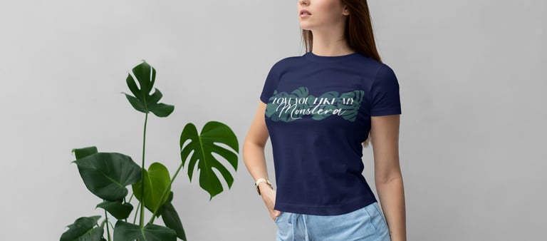 Woman wearing a plant-themed T-shirt styled with botanical accents — Miss Chatty Plants apparel.