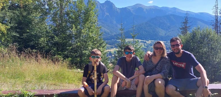tadzik family sitting in the forest 