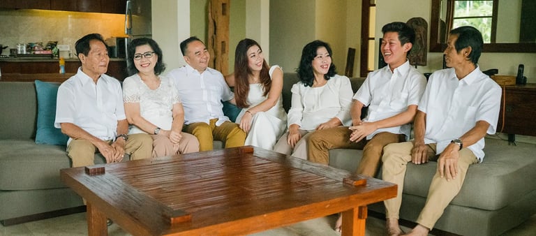 Selly family gathering naturally inside a luxury villa living room during a family photography session at Karma Kandara 