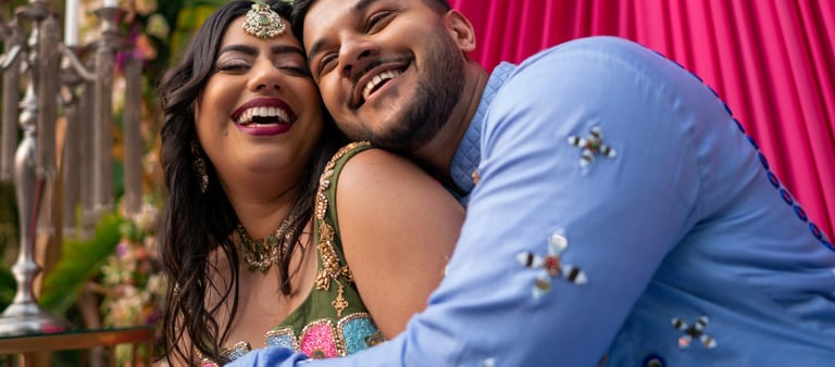 Elegant bride walking through a garden at a classic UK manor wedding.