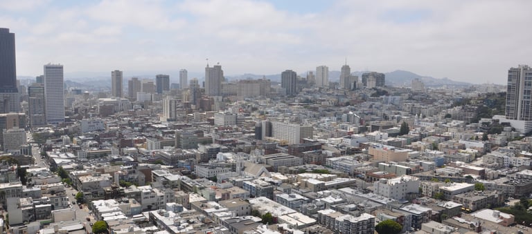 a city skyline view of san francisco with tall buildings