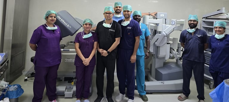 An image showing Dr. Vishal Khante with his team and Da Vinci robot used for surgery