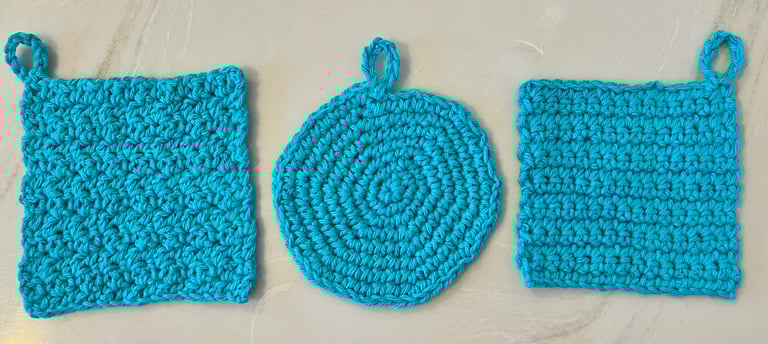 3 aqua crocheted face scrubbies, 2 squares and 1 round shape