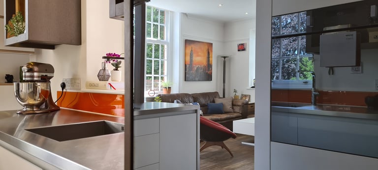 Modern open-plan kitchen architecture in Bury St Edmunds showing ergonomic layout and cooking zones.