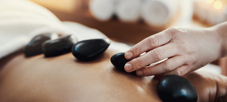 Full body hot stone massage for deep relaxation during Ballarat Winter Festival 2025 – warm winter t