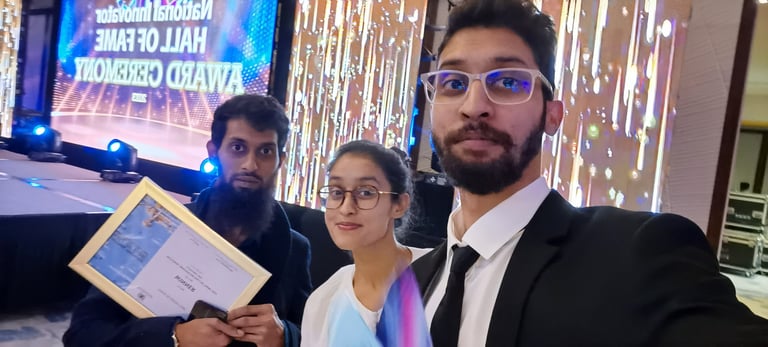 two men, one woman. trophy, award, innovation, mauritius