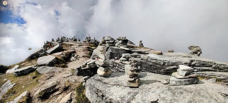 Chandrashila Summit among clouds, Uttarakhand Himalayas, panoramic mountain views.