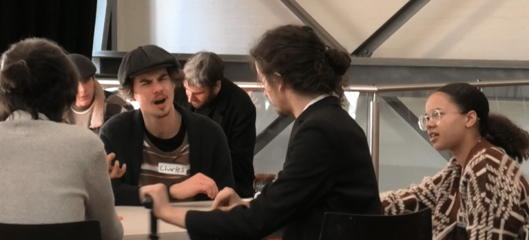 a group of people sitting at a table