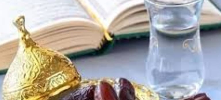 a glass of water dates for fasting and holly quran