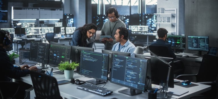 CloudOps team working in a modern office