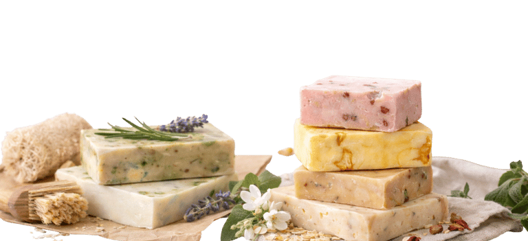 Handmade organic soap bars stacked with natural herbs, lavender, and oats for skincare.