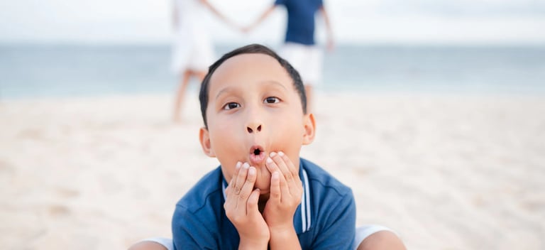 Child portrait during family photography session on beach at The Mulia Nusa Dua Bali