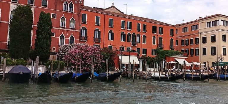 a group of boats on a Canale Grande  in Venice