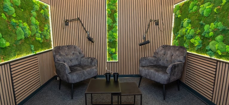 a living room with a mossel plant in the middle of the room