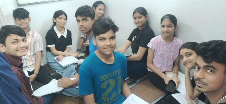 a group of young people sitting on a wooden floor
