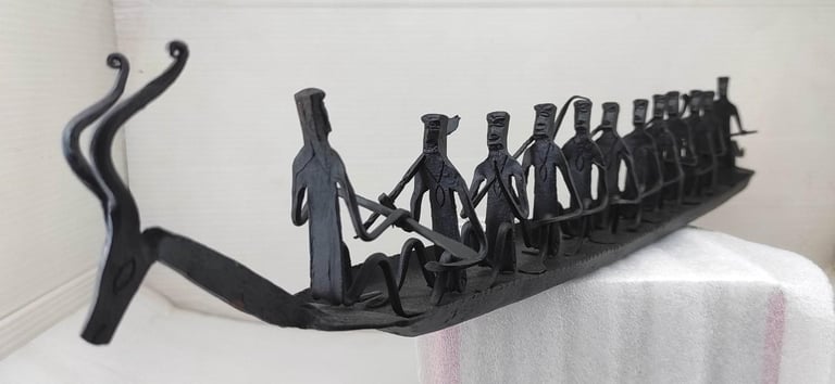 "Handmade Bastar Tribal Iron Boat-with Deer Head and 10 Seated Figures–Left Side View-Export-standard"