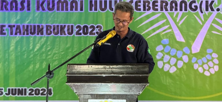 a man standing at a podium with a microphone