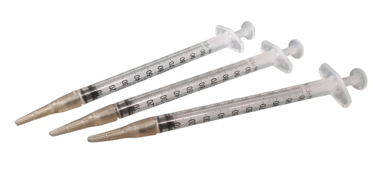Three hand feeding syringes with silicone teats