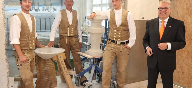 Tradition of the end-of-apprenticeship ceremony by Meister (master) Martin Weisenmayer (centre). So