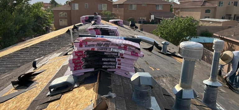a man installing a shingled roof