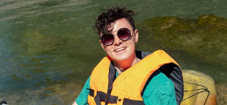 Person kayaking with UV protection in their sunglasses