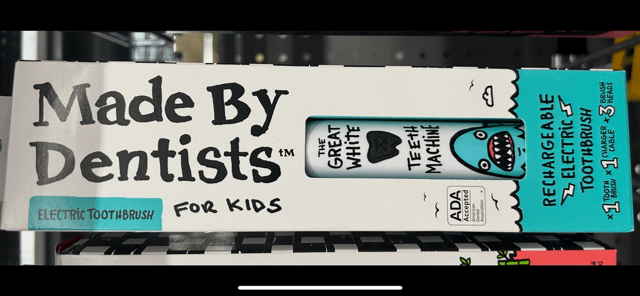 kids rechargeable toothbrush with cartoon shark design.