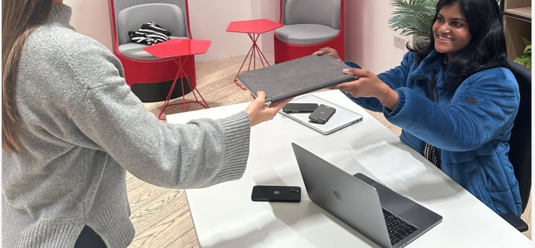 A customer hands over an unwanted laptop at a TTB CircularIT Tech Amnesty event