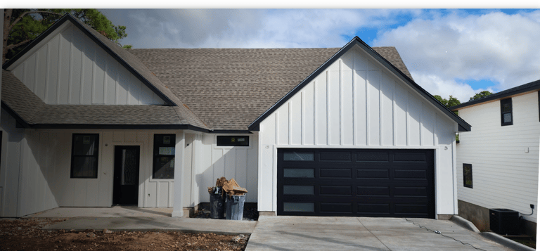 Custom black garage door with windows, Installed by On Point overhead doors In Austin TX