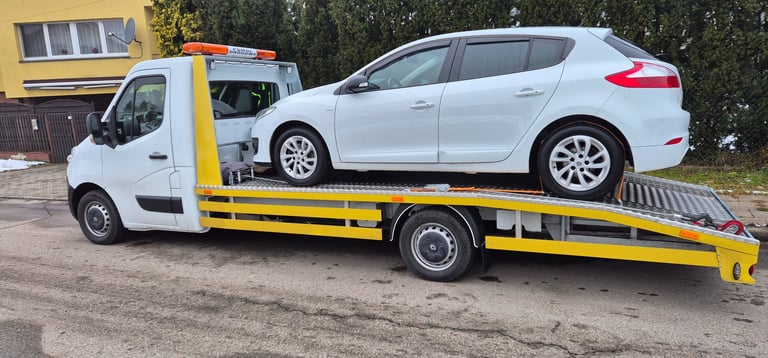 holowanie pojazdu do warsztatu lawetą pomoc drogowa SAFECAR