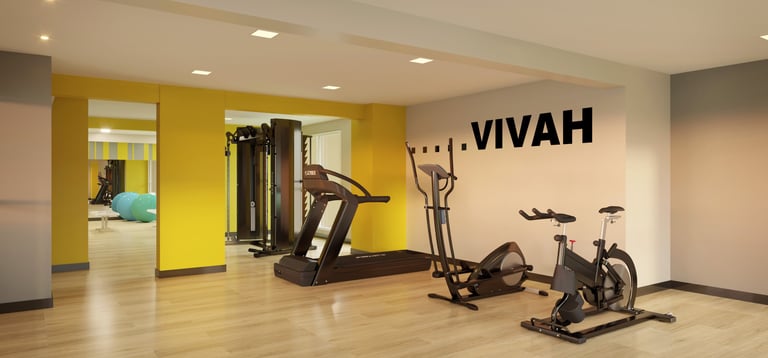 a gym room with a variety of exercise equipment