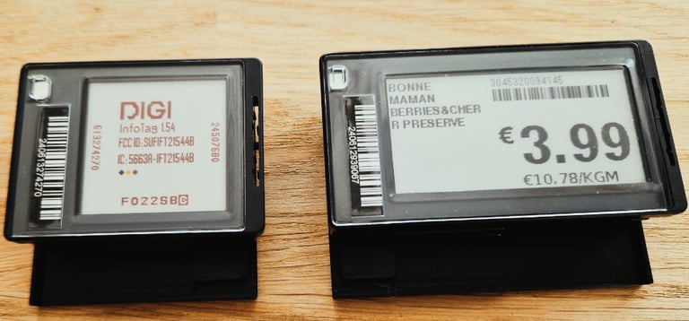 two black and white tags on a wooden table