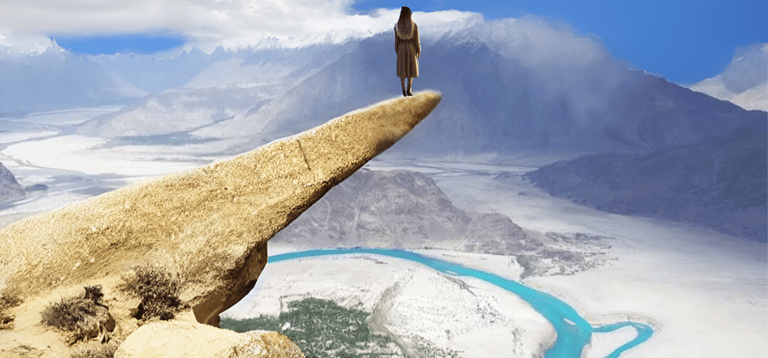 A girl standing at marsur rock skardu
