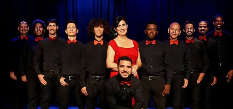 a group of people standing in front of a stage
