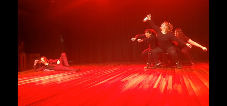 a group of dancers performing on stage