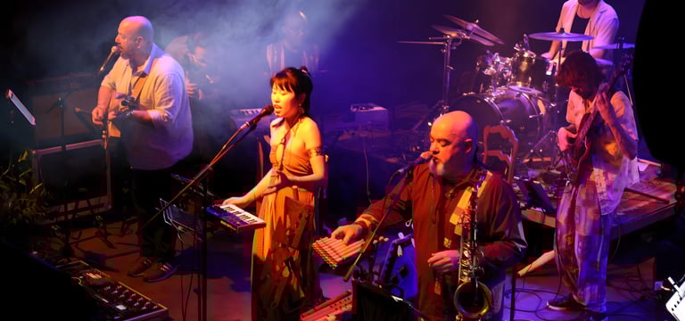 a band of musicians performing on stage